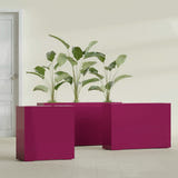 Milano Narrow Rectangular fiberglass planter in Gloss Eggplant, shown planted, in a sunlit interior