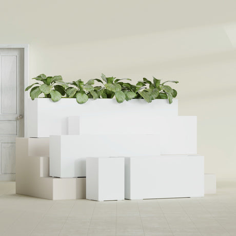 Miami Corner fiberglass planter in Matte Bright White, size range, in a sunlit interior