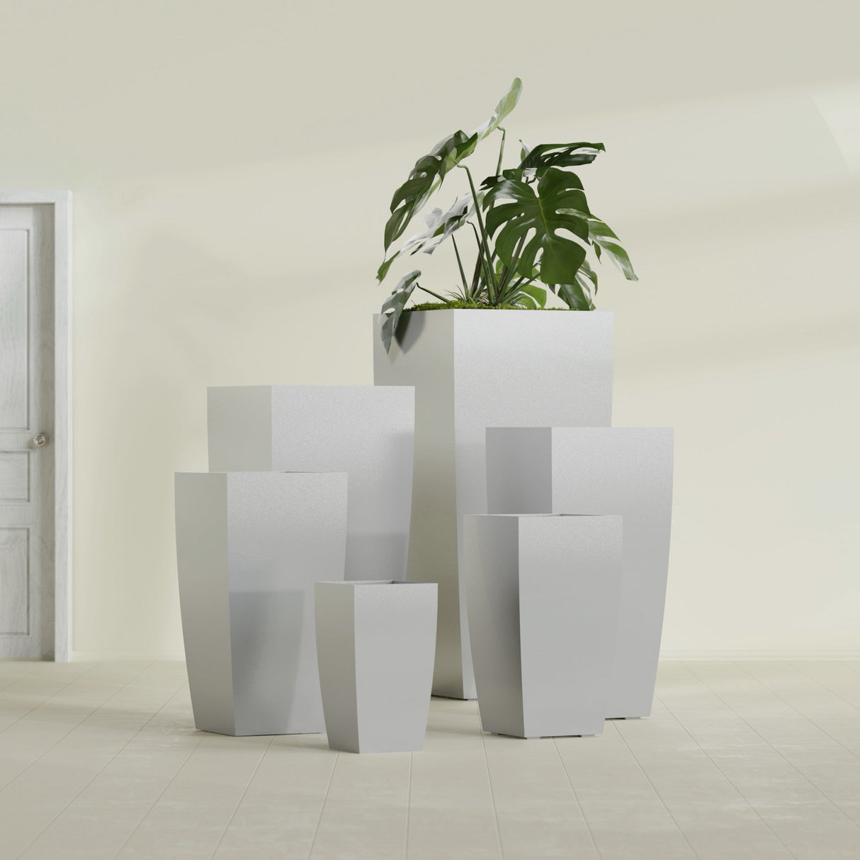 Toulan Tapered Square fiberglass planter in Metallic Silver, size range, in a sunlit interior