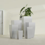 Toulan Tapered Square fiberglass planter in Metallic Silver, size range, in a sunlit interior