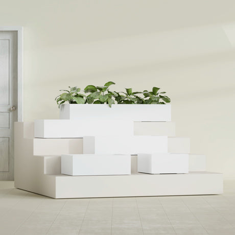 Antwerp Corner fiberglass planter in Matte Bright White, size range, in a sunlit interior