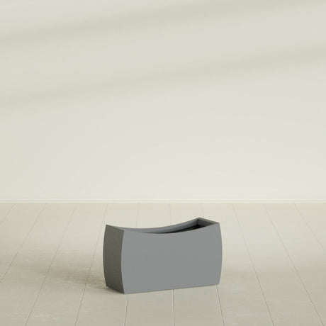 Seoul Curved Planter in Matte Gunmetal, 32"L × 12"D × 18"H, shown empty
