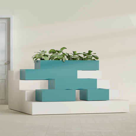 Antwerp Corner fiberglass planter in Satin Seafoam Green, size range, in a sunlit interior
