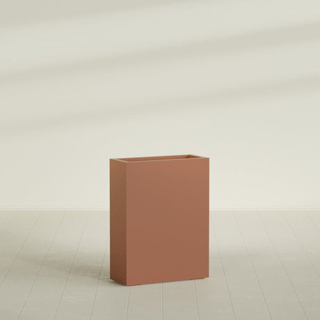 Amesbury Narrow Rectangular Planter in Matte Terra Cotta, 24"L × 10"D × 32"H, shown empty