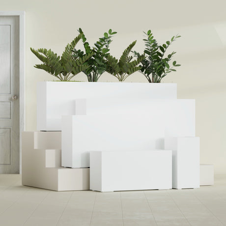 Hollywood Corner fiberglass planter in Matte Bright White, size range, in a sunlit interior