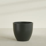 Wannsee Round Planter in Matte Charcoal, 50"D × 44"H, shown empty