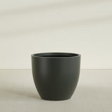 Wannsee Round Planter in Matte Charcoal, 50"D × 44"H, shown empty