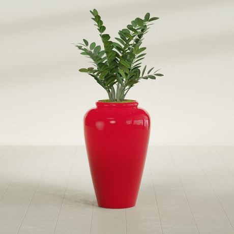 Barà Jar fiberglass planter in Gloss Red, shown planted, in a sunlit interior