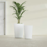 Tegel Round Tapered fiberglass planter in Matte Bright White, size range, in a sunlit interior