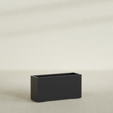 Tolga Rectangular Planter in Matte Black, 48"L × 16"D × 24"H, shown empty