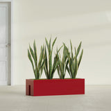 Tiergarden Railing fiberglass planter in Gloss Red, shown planted, in a sunlit interior