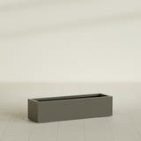 Cuba Low Rectangular Planter in Matte Bronze, 48"L × 14"D × 12"H, shown empty