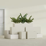 Tolga Rectangular fiberglass planter in Satin Beige, size range, in a sunlit interior