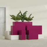 Potsdam Corner fiberglass planter in Gloss Eggplant, size range, in a sunlit interior