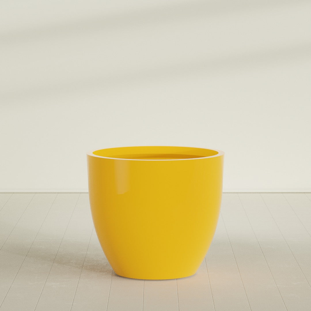 Wannsee Round Planter in Gloss Saffron, 50"D × 44"H, shown empty