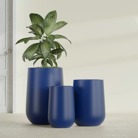 Hayden Urn fiberglass planter in Matte Cobalt Blue, size range, in a sunlit interior