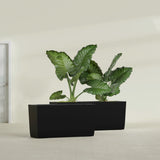 Panama Tapered Rectangular fiberglass planter in Matte Black, shown planted, in a sunlit interior