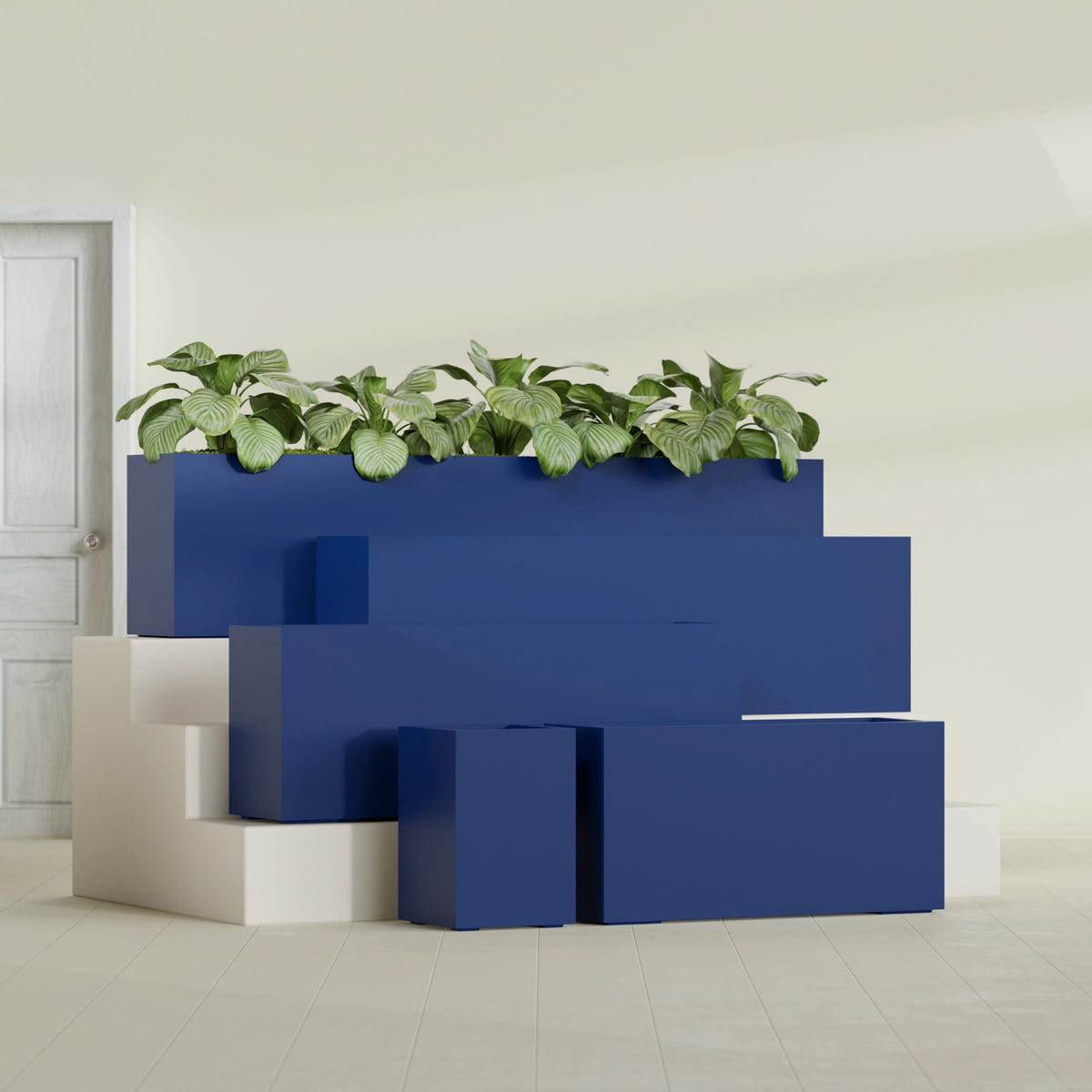 Miami Narrow Rectangular fiberglass planter in Matte Cobalt Blue, size range, in a sunlit interior