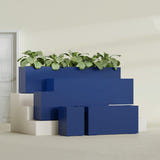 Miami Narrow Rectangular fiberglass planter in Matte Cobalt Blue, size range, in a sunlit interior