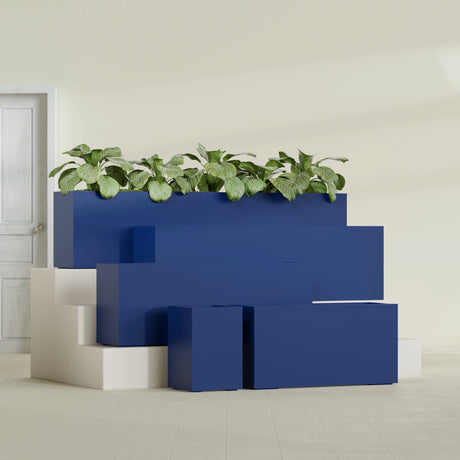 Miami Corner fiberglass planter in Matte Cobalt Blue, size range, in a sunlit interior