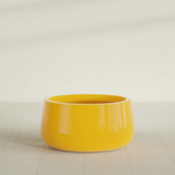 Short Hayden Bowl Planter in Gloss Saffron, 20"D × 10"H, shown empty