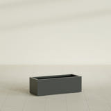 Cuba Low Rectangular Planter in Matte Charcoal, 36"L × 14"D × 12"H, shown empty