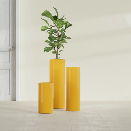 Corry Cylinder fiberglass planter in Gloss Saffron, size range, in a sunlit interior