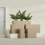 Potsdam Corner fiberglass planter in Gloss Metallic Gold, size range, in a sunlit interior