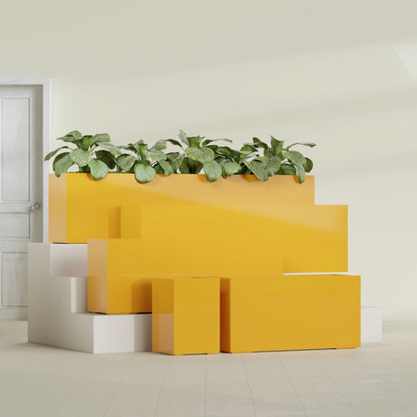 Miami Corner fiberglass planter in Gloss Saffron, size range, in a sunlit interior
