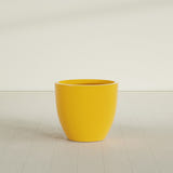 Wannsee Round Planter in Gloss Saffron, 33"D × 29"H, shown empty