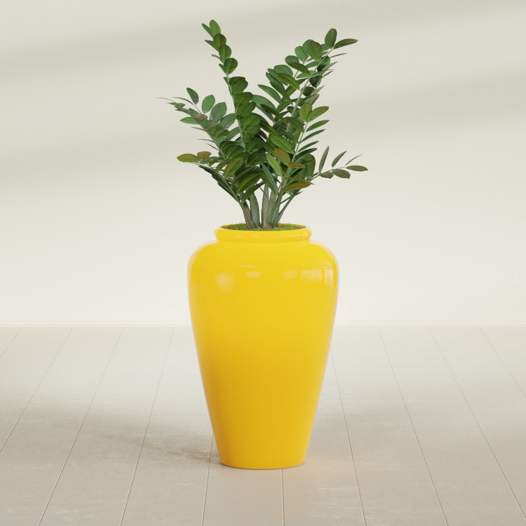 Barà Jar fiberglass planter in Gloss Saffron, shown planted, in a sunlit interior