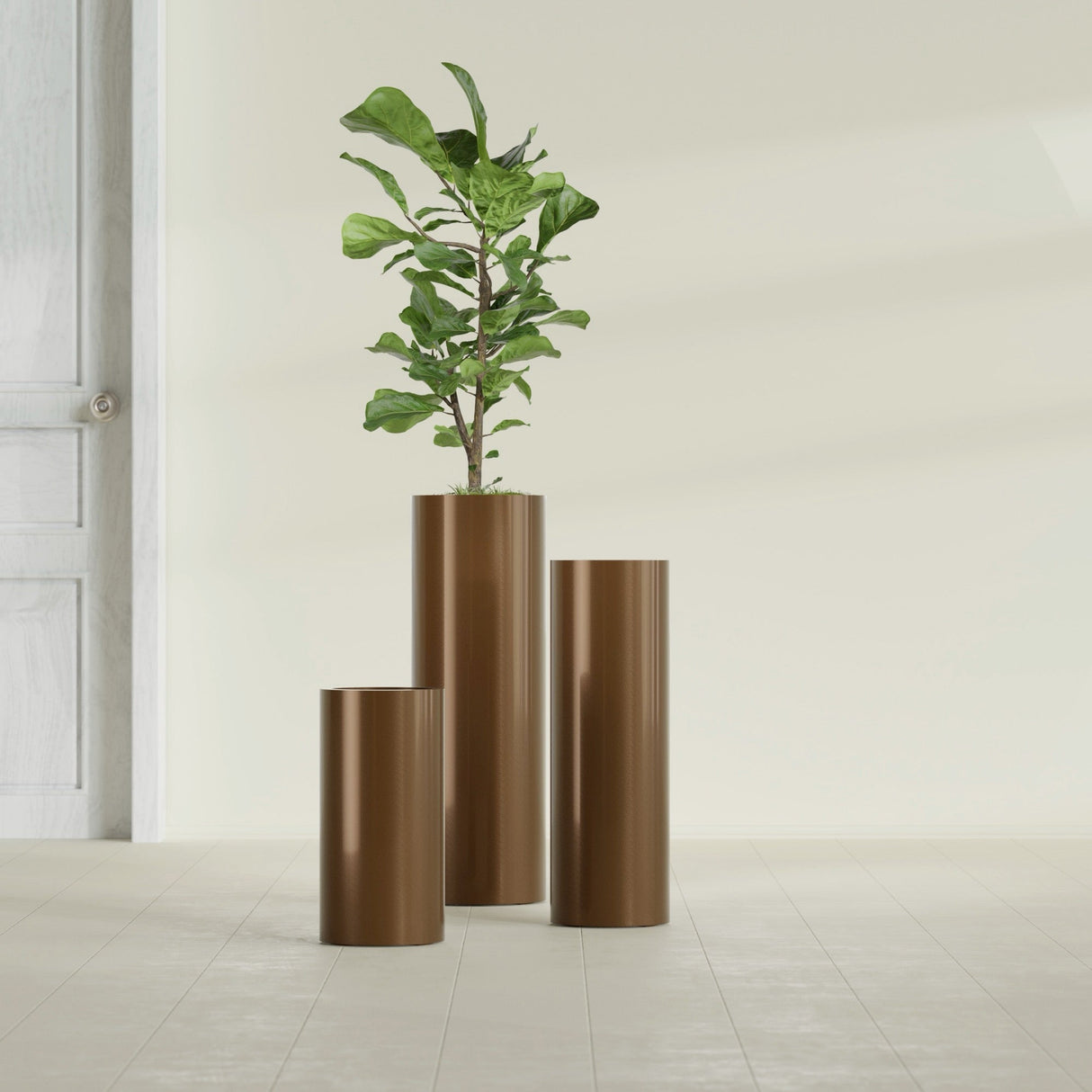 Corry Cylinder fiberglass planter in Metallic Bronze, size range, in a sunlit interior