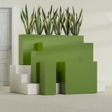 Delray Corner fiberglass planter in Satin Green, size range, in a sunlit interior