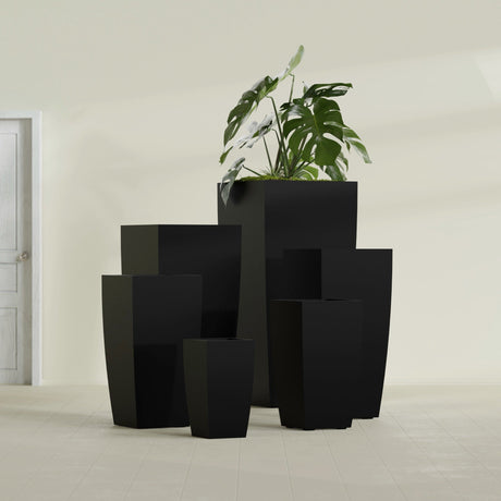 Toulan Tapered Square fiberglass planter in Matte Black, size range, in a sunlit interior