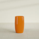 Lisbon tall round tapered fiberglass planter in Gloss Tangerine, 18 in diameter, 32 in high, shown empty