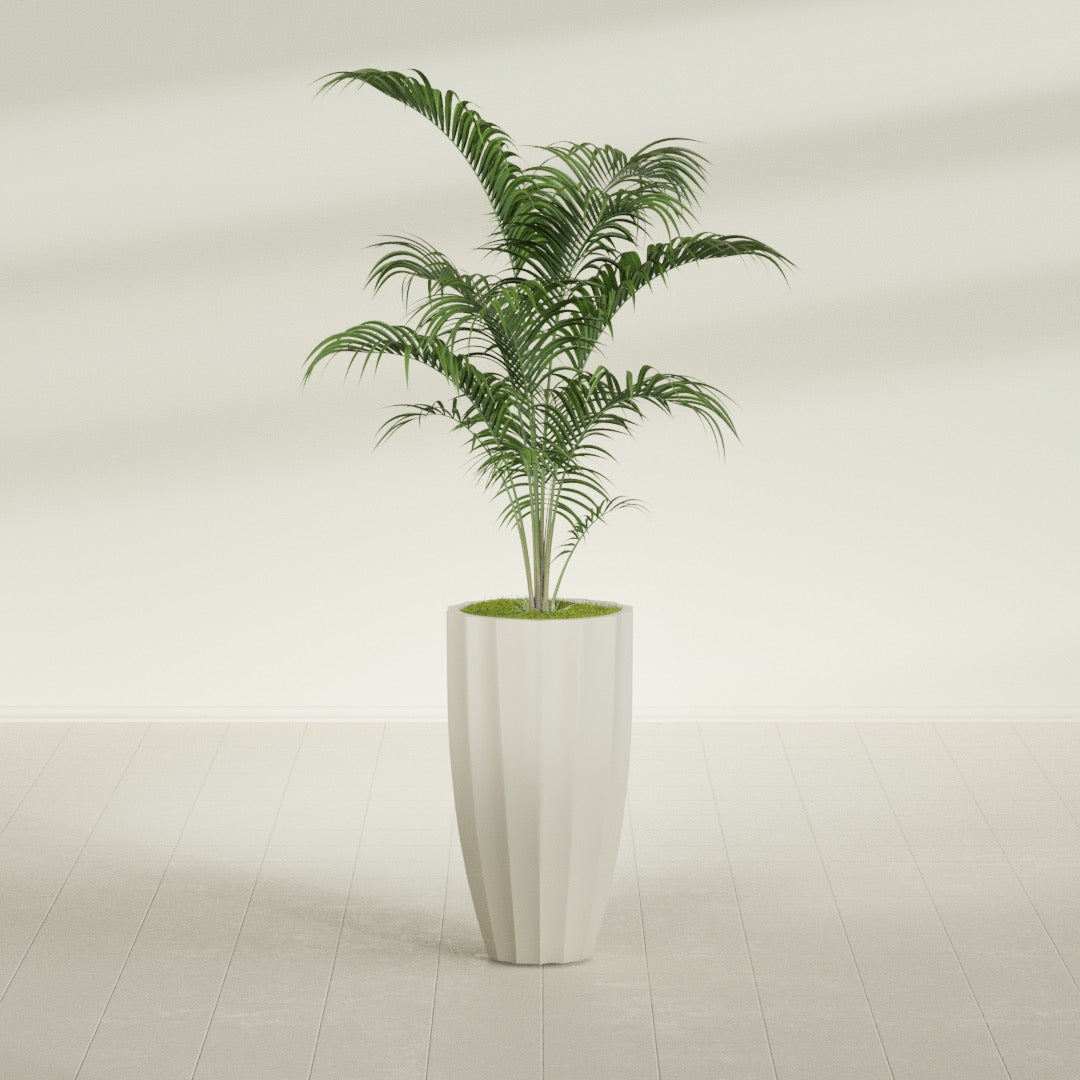San Jose Tall Fluted fiberglass planter in Satin Beige, shown planted, in a sunlit interior