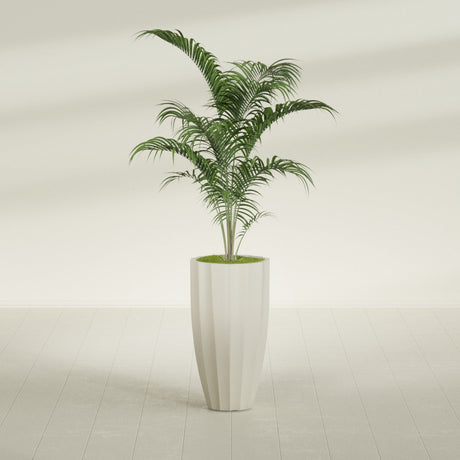 San Jose Tall Fluted fiberglass planter in Satin Beige, shown planted, in a sunlit interior