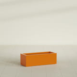 Cuba Low Rectangular Planter in Gloss Tangerine, 36"L × 14"D × 12"H, shown empty