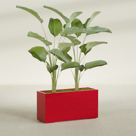 Tolga Corner fiberglass planter in Gloss Red, shown planted, in a sunlit interior