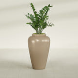 Barà Jar fiberglass planter in Gloss Metallic Gold, shown planted, in a sunlit interior