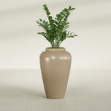 Barà Jar fiberglass planter in Gloss Metallic Gold, shown planted, in a sunlit interior