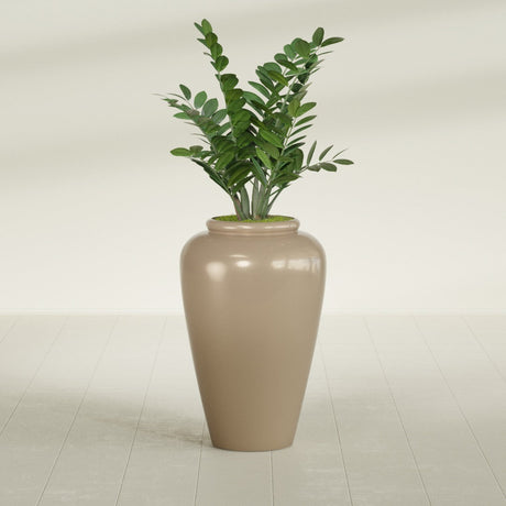 Barà Jar fiberglass planter in Gloss Metallic Gold, shown planted, in a sunlit interior