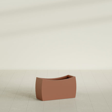 Seoul Curved Planter in Matte Terra Cotta, 32"L × 12"D × 18"H, shown empty