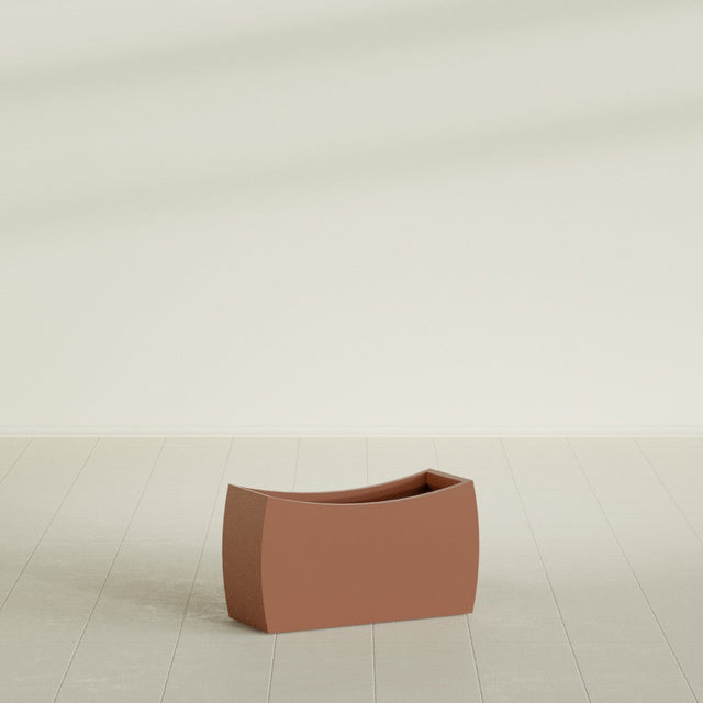 Seoul Curved Planter in Matte Terra Cotta, 32"L × 12"D × 18"H, shown empty