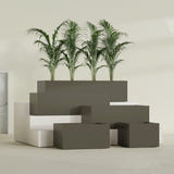 Torino Wide Rectangular fiberglass planter in Matte Bronze, size range, in a sunlit interior