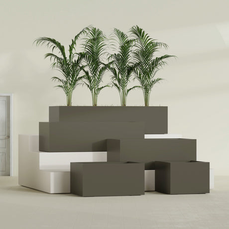 Torino Corner fiberglass planter in Matte Bronze, size range, in a sunlit interior