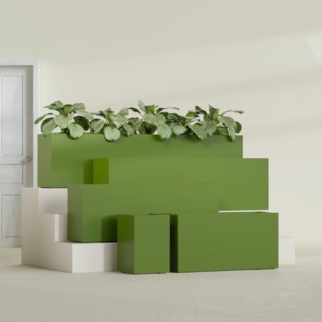 Miami Corner fiberglass planter in Satin Green, size range, in a sunlit interior