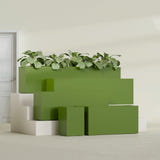 Miami Narrow Rectangular fiberglass planter in Satin Green, size range, in a sunlit interior
