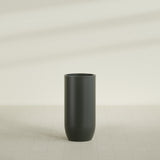Saint Tropez Bullet Round Planter in Matte Charcoal, 24"D × 50"H, shown empty