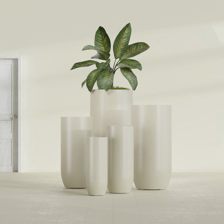 Saint Tropez Bullet Round fiberglass planter in Satin Beige, size range, in a sunlit interior